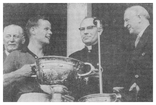 Down captain Kevin Mussen receives the Sam Maguire cup from President Eamon Devalera in 1960.