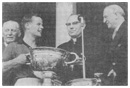 Down captain Kevin Mussen receives the Sam Maguire cup from President Eamon Devalera in 1960.
