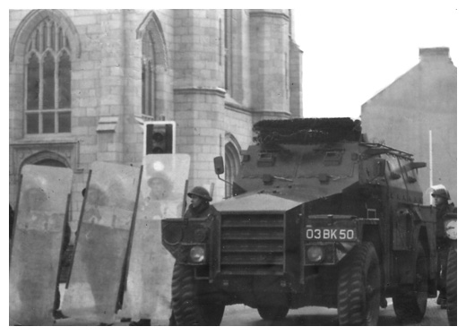 The British Army riot squad prepare to attack demonstrators who were protesting against the shooting of three unarmed young men in Newry town centre.