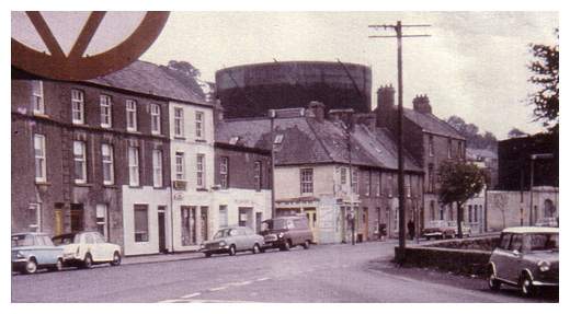 Kilmorey street in Newry with large gasometer in the background.