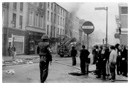 Newry people survey the damage in the town centre on the morning of Internment when many Civil Rights activists were taken from their homes.