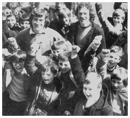 Pat Jennings and his brother Brian, former sportsmaster at St Paul's High School with pupils at Whitehart Lane.