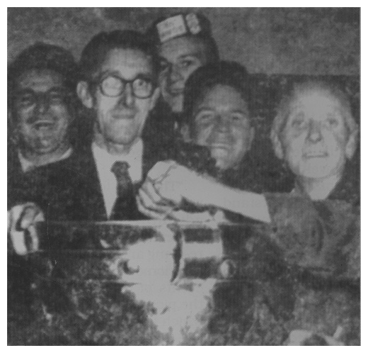 President of Down G.A.A. and long time County Secretary, Peadar Barry proudly holds the Sam Maguire Cup in the Down dressing room after the 1960 final.