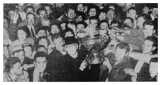 The Sam Maguire Cup is brought across the border for the first time as Down caption Kevin Mussen and Father Hugh Esler carry the coveted trophy into the north after the historic triumph in 1960.